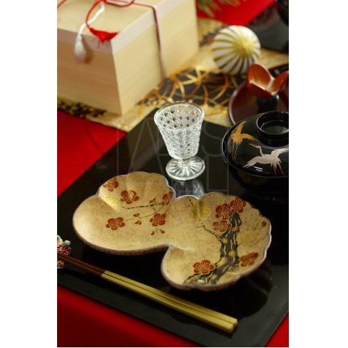 Sake cups and pots arranged on a traditional Japanese table during a quiet moment